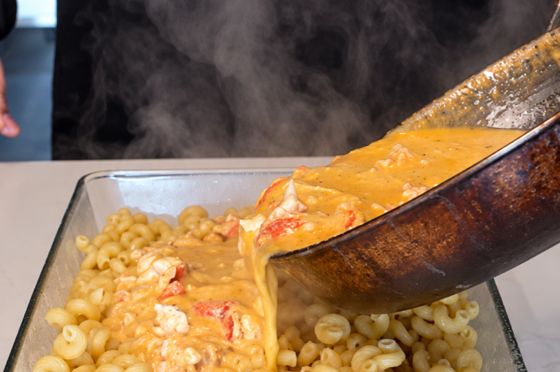 Pouring sauce over the pasta
